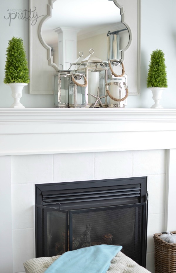 Summer decorating mantel with lanterns