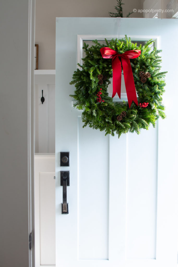 Real wreath on aqua door